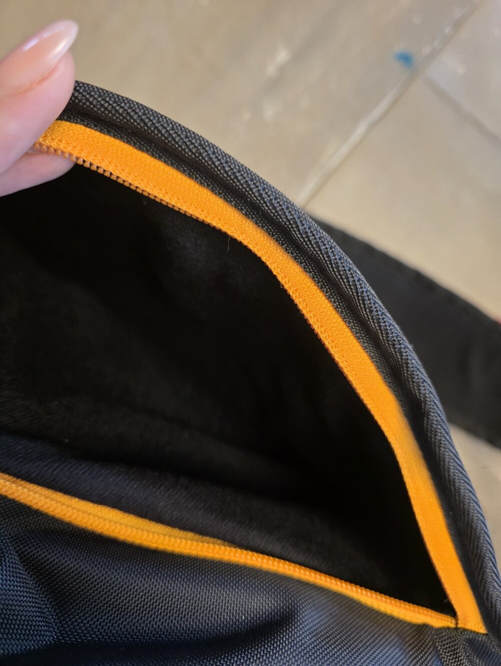 Sherpani black sling bag with blue and orange accents - Picture 3 of 5